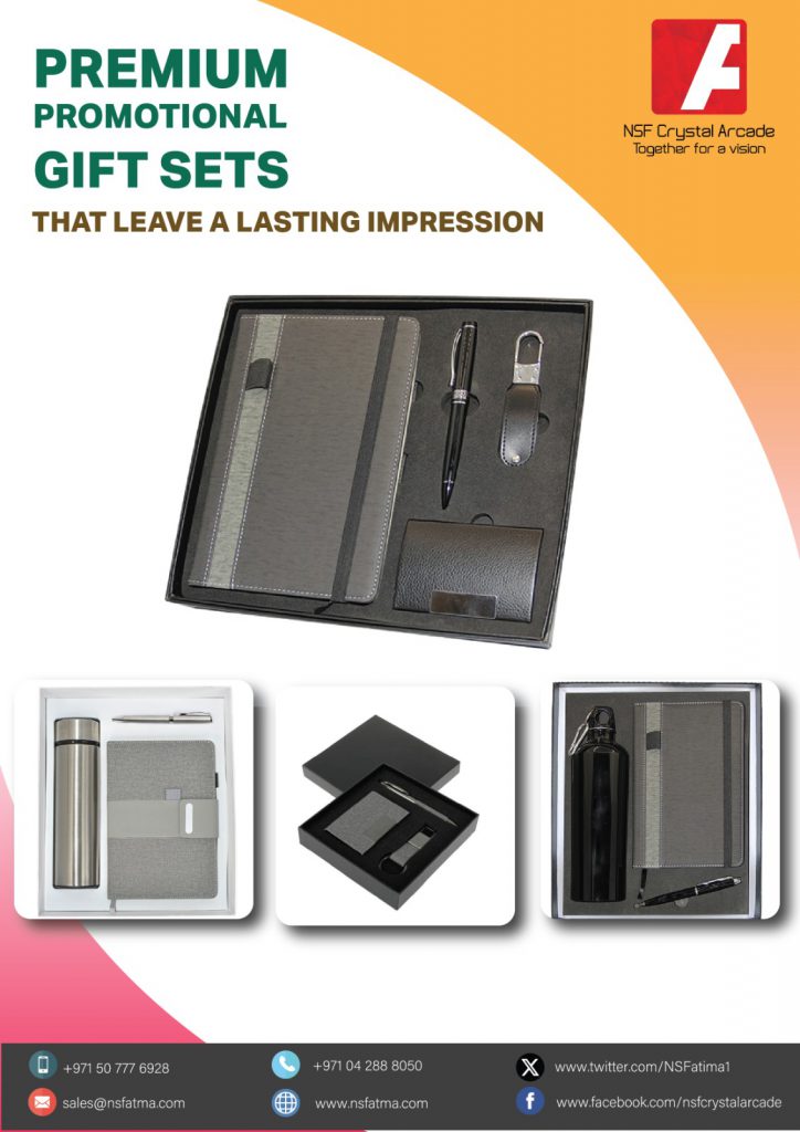 Promotional gift set featuring a sleek pen, a stylish water bottle, a high-quality notebook, and a compact USB drive, all presented together as part of a branded collection.