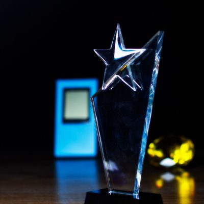 Clear-Crystal-Star-Topped-Obelisk-with-Beveled-Edges-on-a-Black-Pedestal.jpg